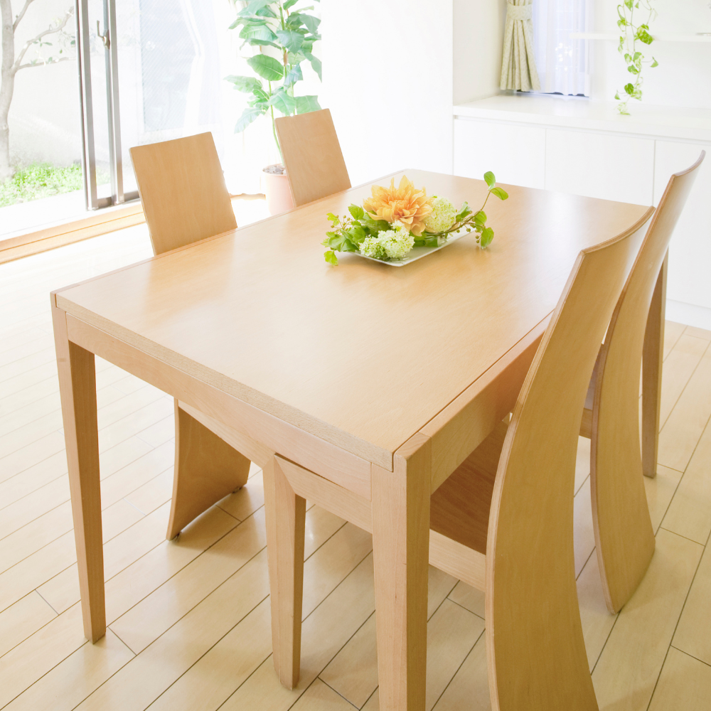 modern table and chairs in light colored wood